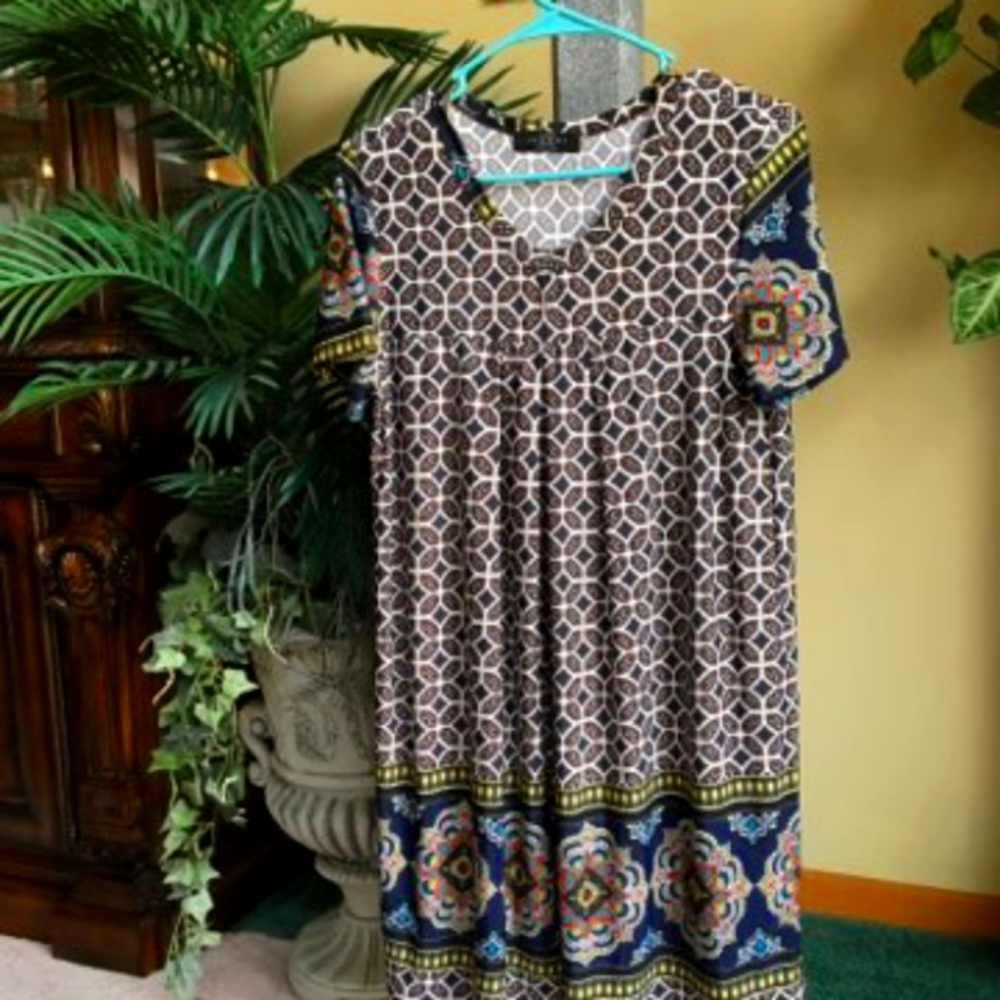 This shirt is Made By JOHNNY . This shirt is in a smoke free home.